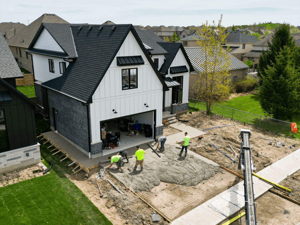 Brosco Concrete crew placing and finishing concrete: crew at new-build driveway pour