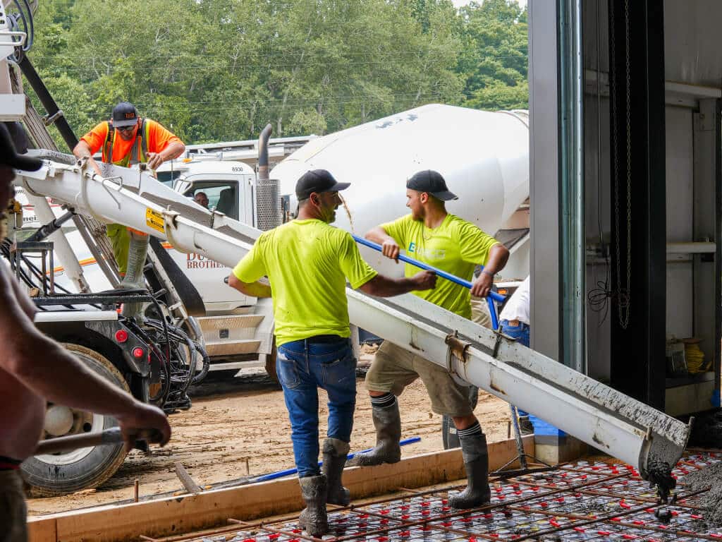 Power trowel finishing on a commercial concrete floor