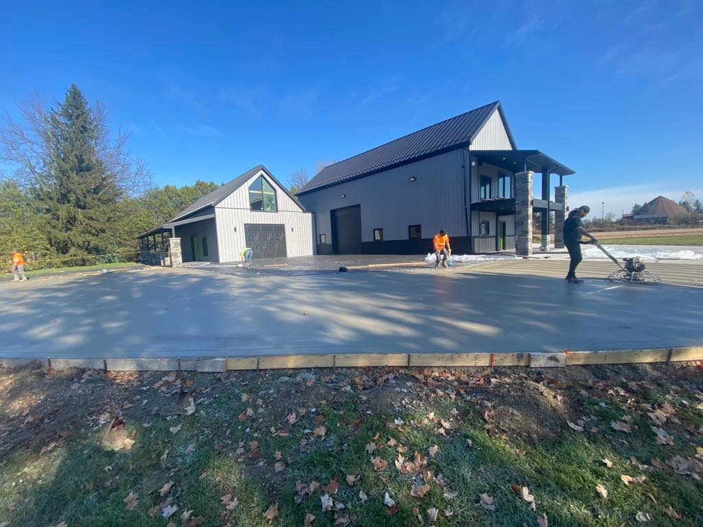 Commercial concrete: large fresh slab outside barn building