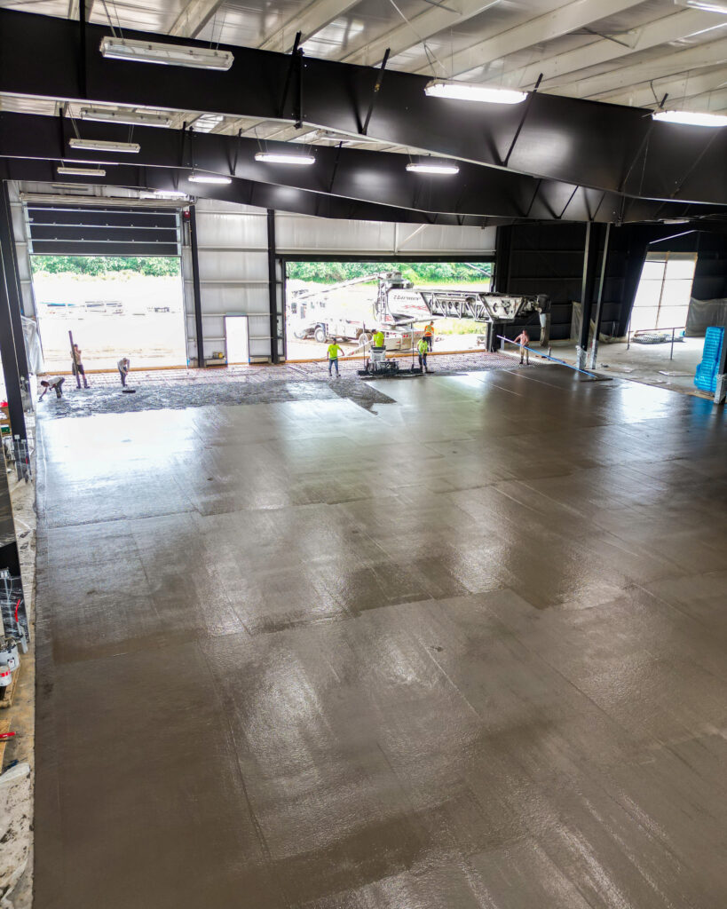 Finished commercial concrete floor inside a steel-frame building