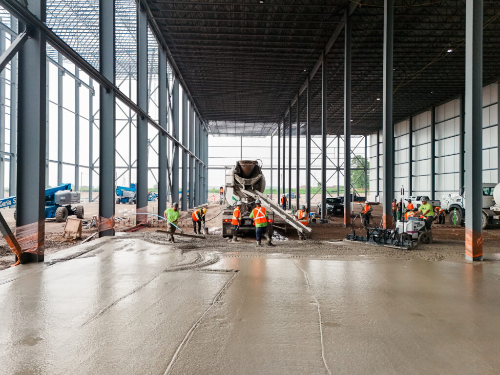 Power trowel finishing a commercial concrete floor