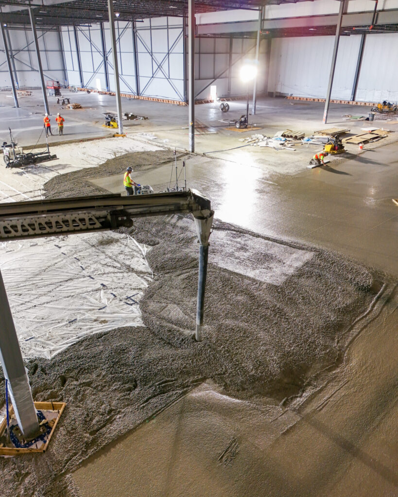 Laser screed levelling a large commercial concrete pour