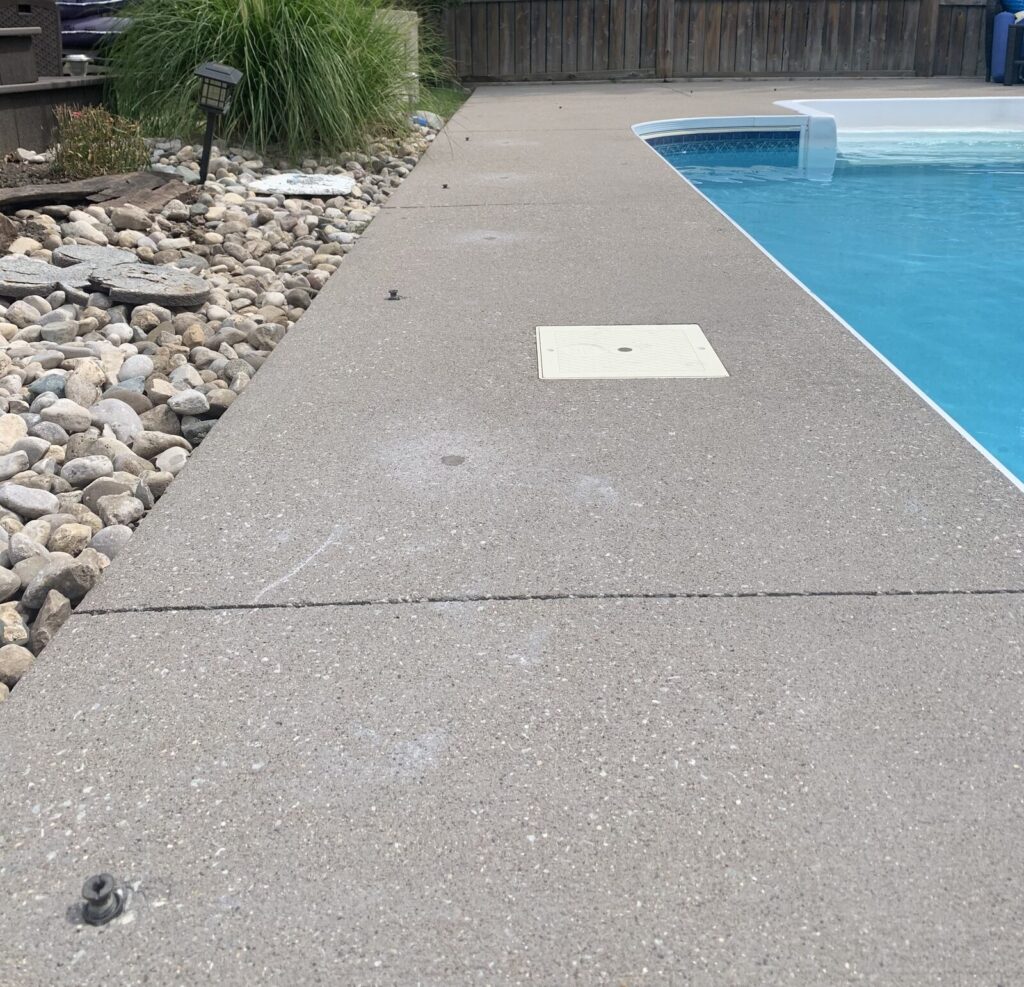 The same concrete pool deck raised back to grade