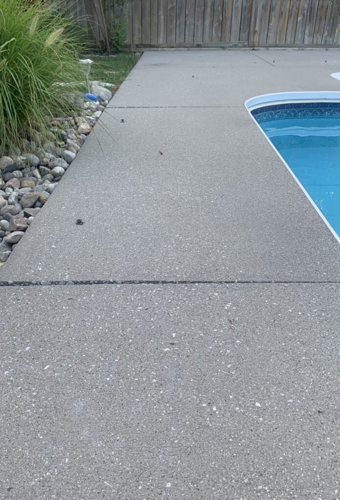 Settled concrete pool deck before polyurethane raising and levelling